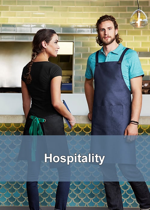 Employees in the hospitality industry wearing denim aprons while working